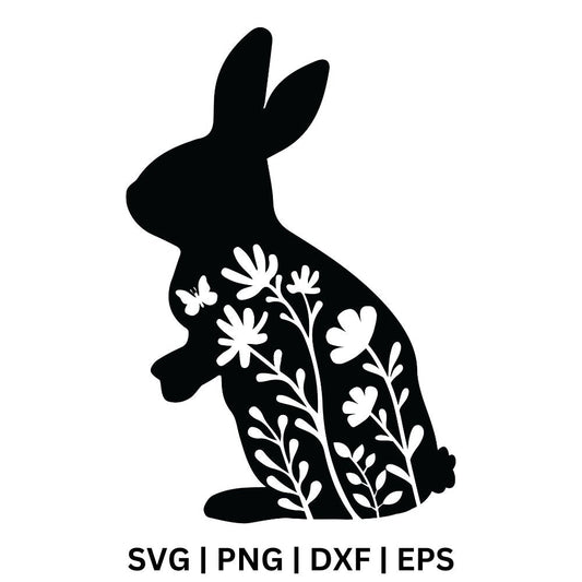 Black sitting bunny silhouette with white floral and leaf cutouts and a small butterfly, free Easter floral bunny SVG cut file preview.