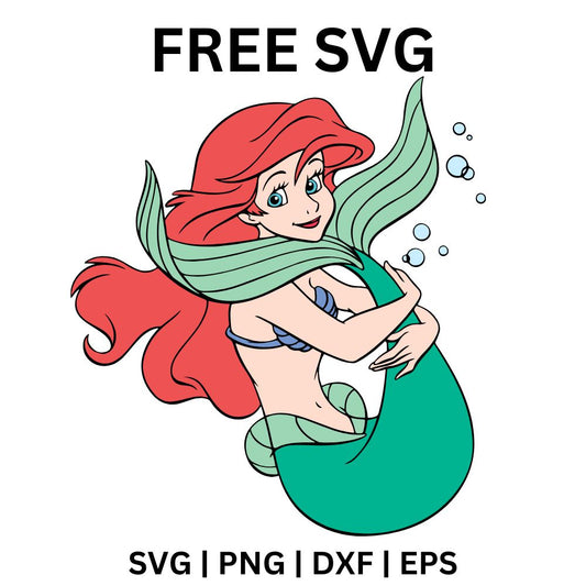 Shy cartoon mermaid with flowing red hair curled up hugging her green tail among wavy seaweed leaves, free mermaid SVG cut file preview.