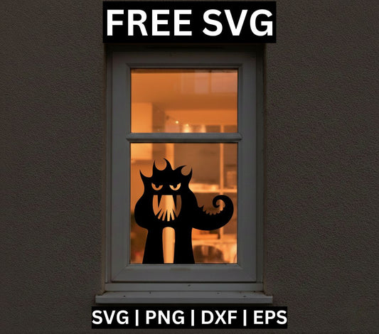 Black spooky cat silhouette with glowing slanted eyes, a fanged mouth and a curled tail, shown as a window cling on a warmly lit window, free Halloween window decoration SVG cut file preview.